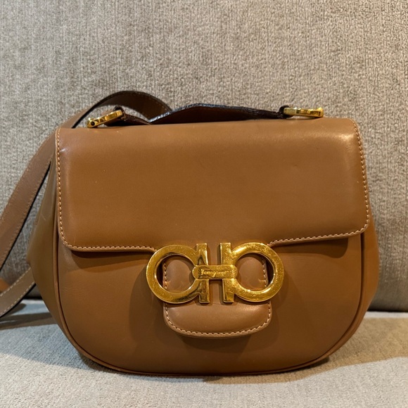 Salvatore Ferragamo Handbags - Salvatore Ferragamo Vara/Gancini crossbody in tan leather with gold hardware.